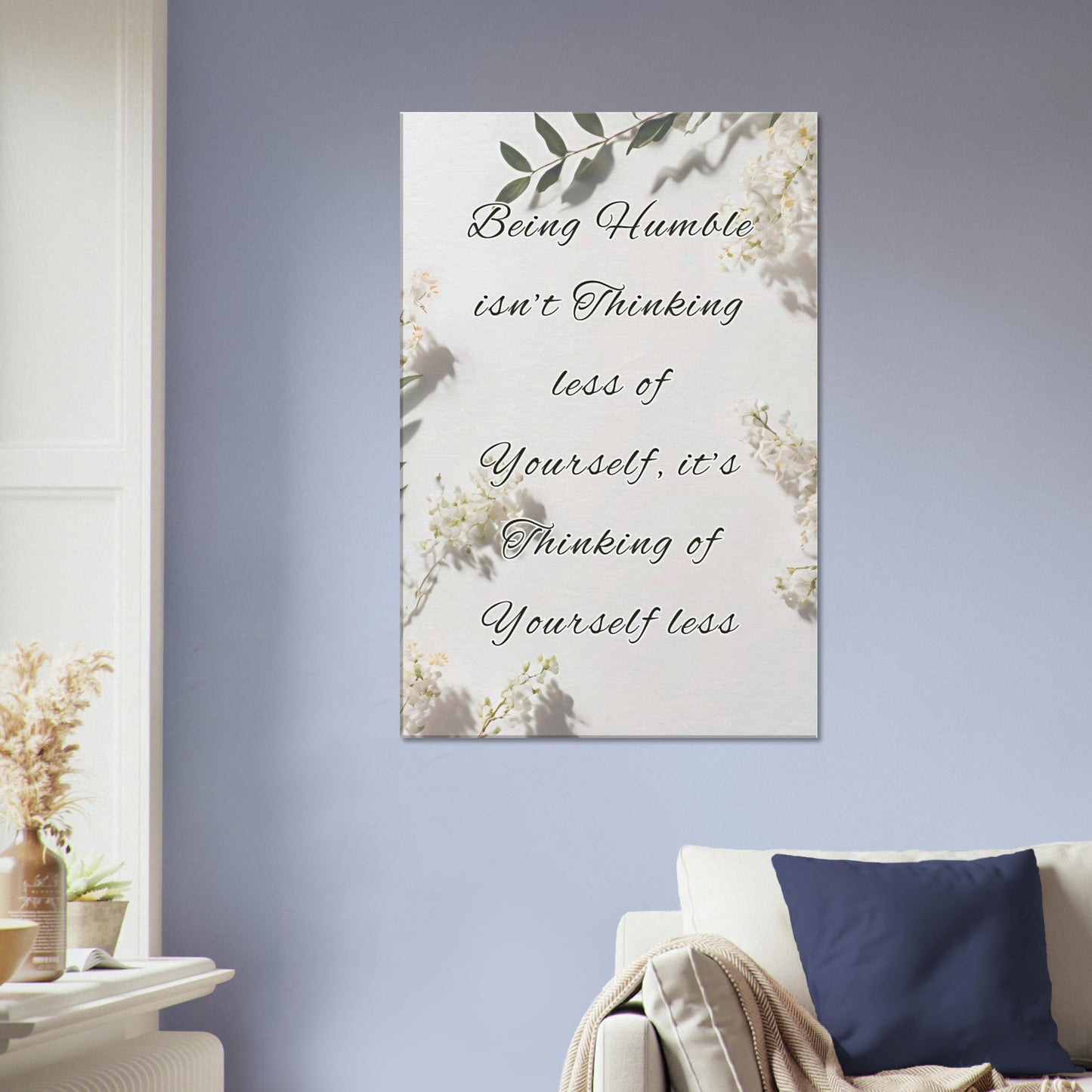 Inspirational wall art featuring white flowers and message on thinking of others