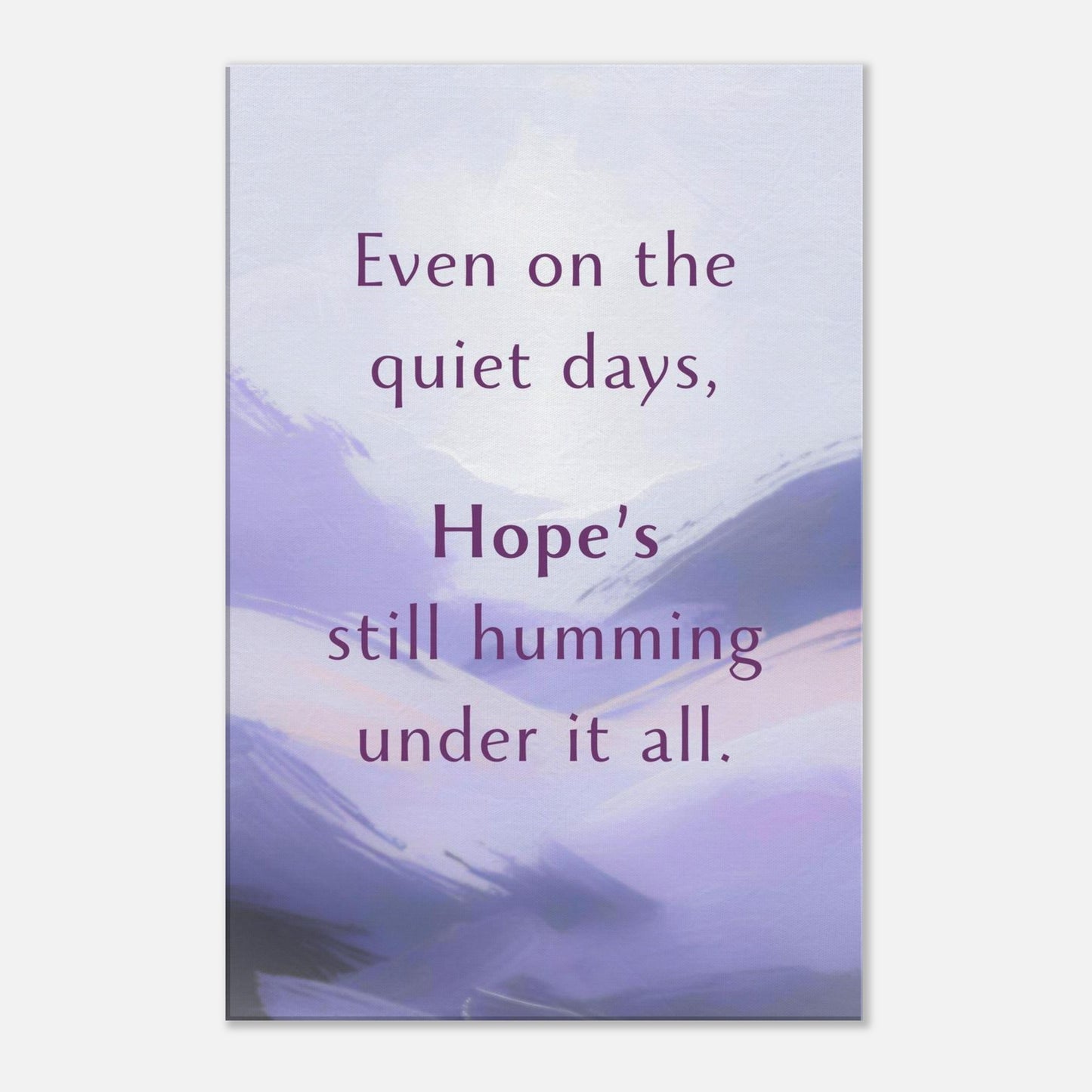 Canvas wall art with the quote "Even on the quiet days, hope’s still humming under it all" over a soft textured background