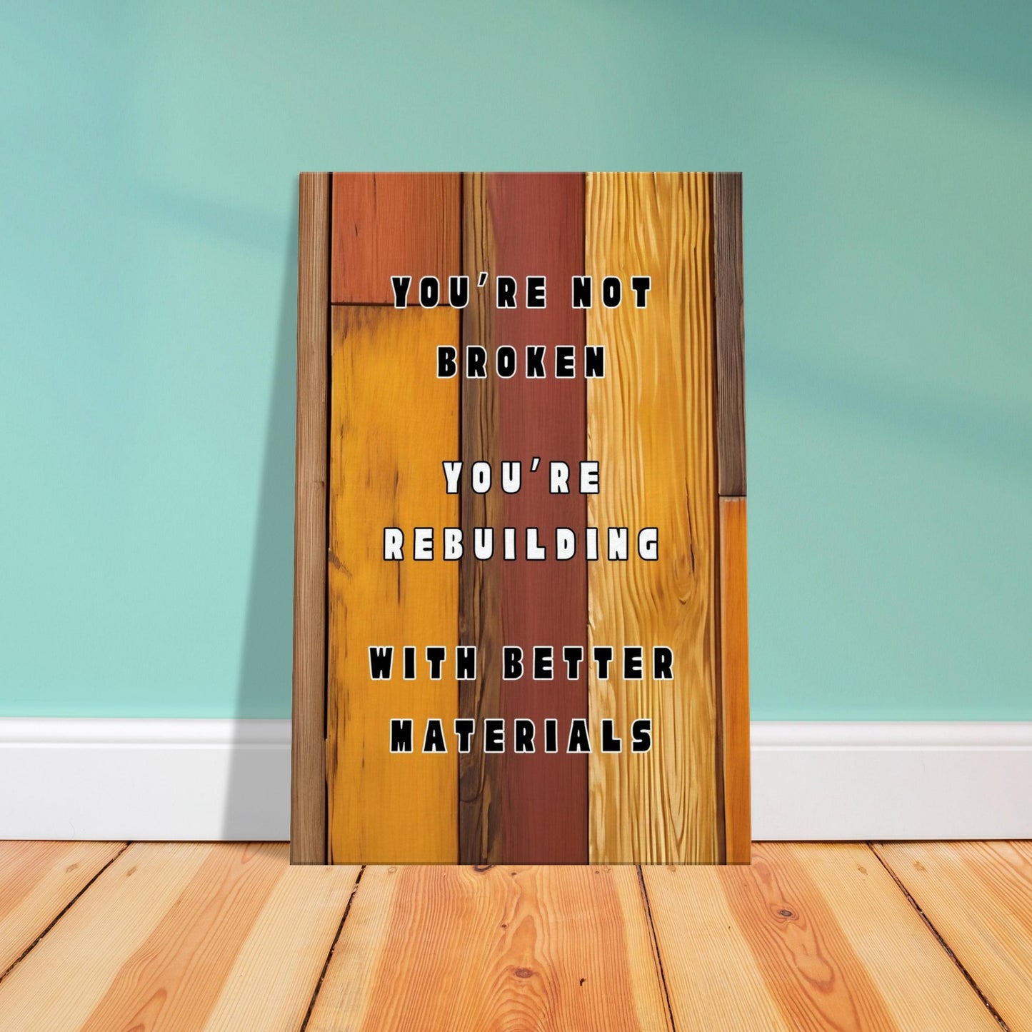 Recovery-themed canvas print with warm hardwood tones and bold rebuilding affirmation quote.