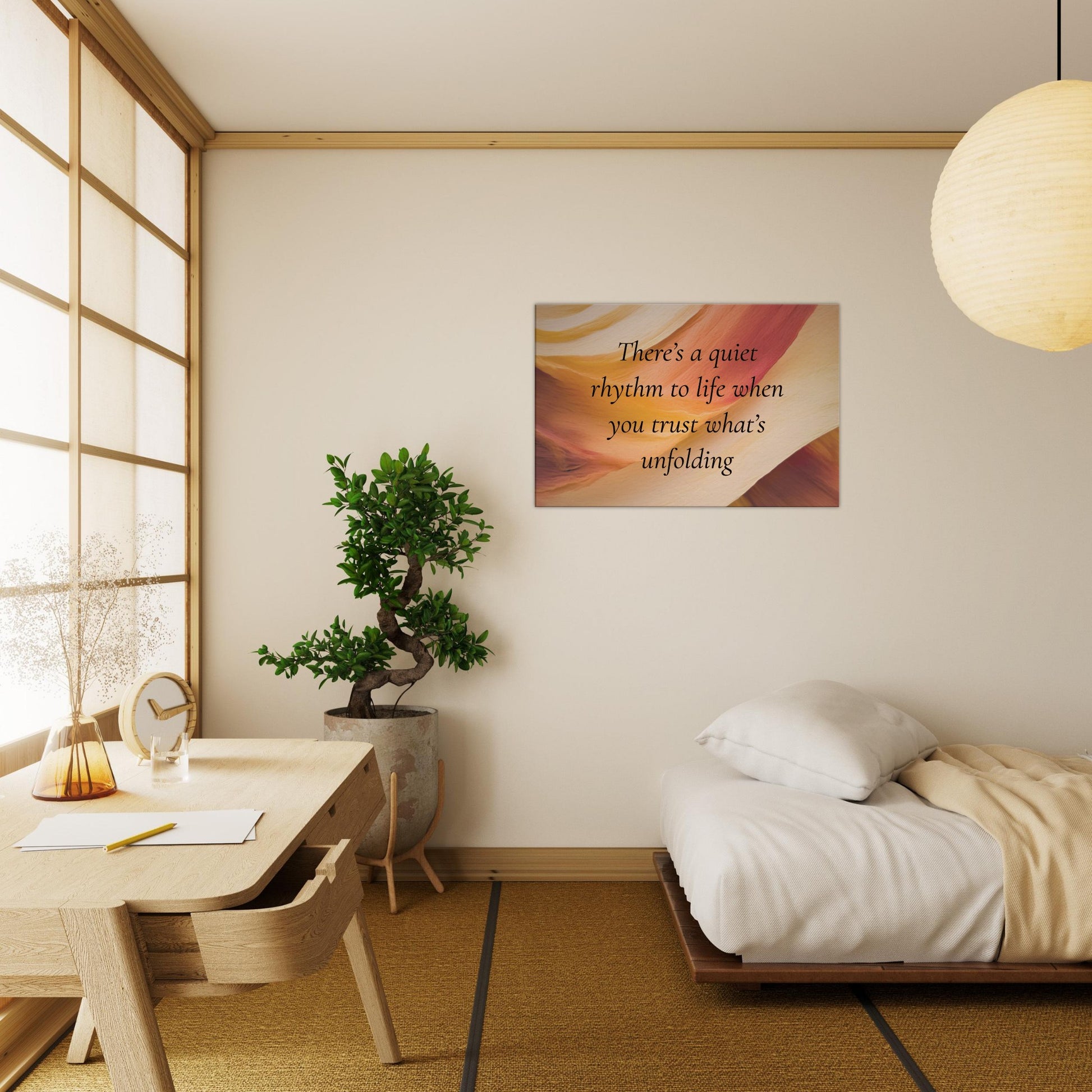 Canvas wall print with a quote "There's a quiet rhythm to life when you trust what's unfolding" on an abstract background with warm red, cream and caramel colors.  The spiritual canvas art is hanging on an off beige wall as bedroom decor. 