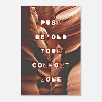 Motivational canvas wall art with 'Push Beyond Your Comfort Zone' on burgundy rock backdrop.