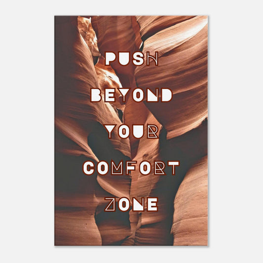 Motivational canvas wall art with 'Push Beyond Your Comfort Zone' on burgundy rock backdrop.