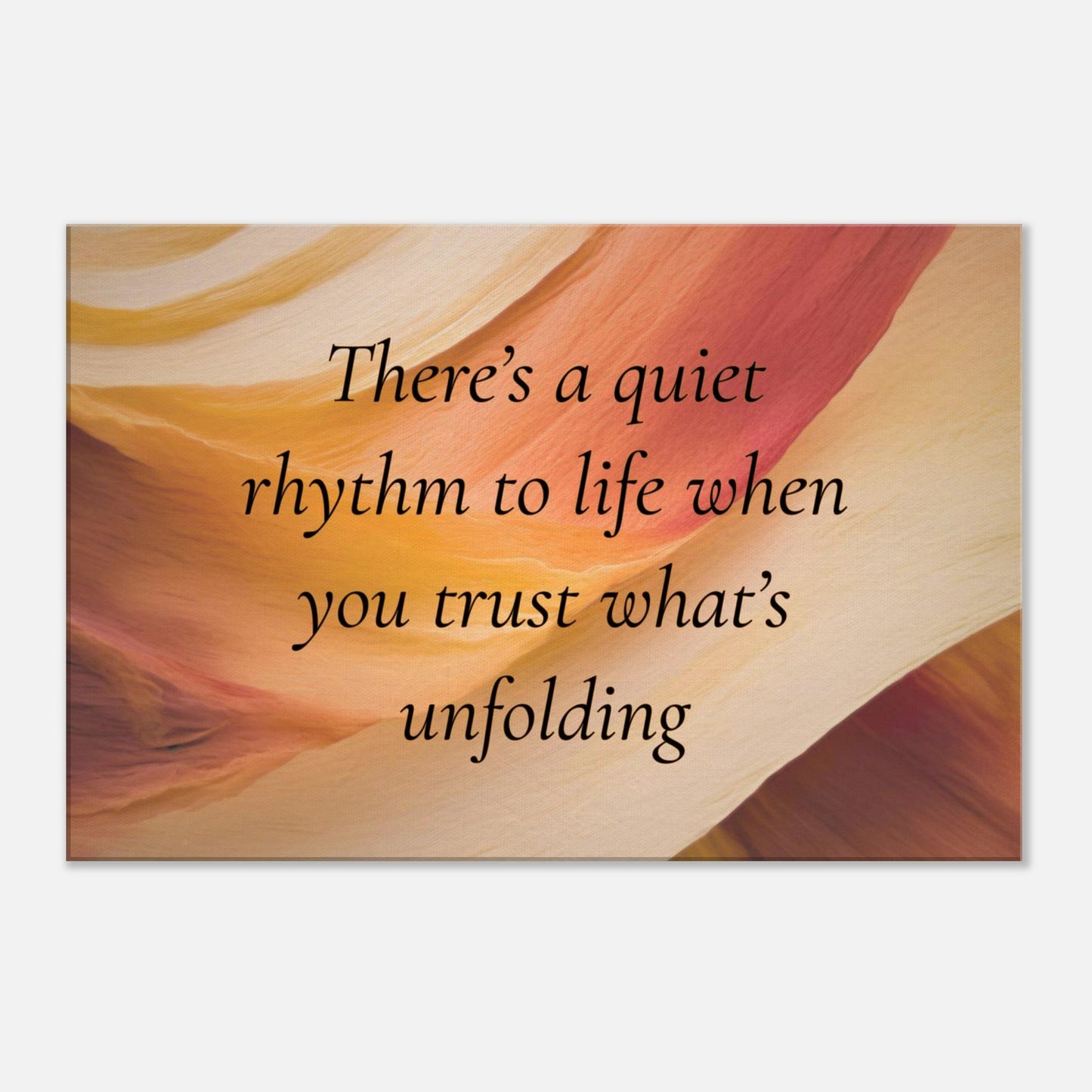 Canvas wall art with a quote "There's a quiet rhythm to life when you trust what's unfolding" on an abstract background with warm red, cream and caramel colors.  The canvas is placed on a white wall background. 