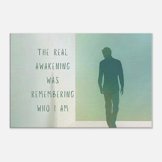 Canvas wall art with a quote "The real awakening was remembering who I am" on a light beige and green background with a silhouette of a man.  The wall art is placed against a white background.  