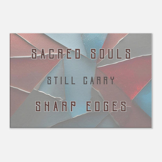 Canvas wall art with quote "Sacred souls still carry sharp edges" on a muted blue, gray and red background with broken glass.  The home decor has a simple white background as a wall. 