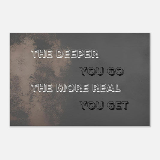 Canvas wall art with quote "The Deeper You Go The More Real You Get" over a muted rustic brown and black background.  This decor is set on a white wall. 