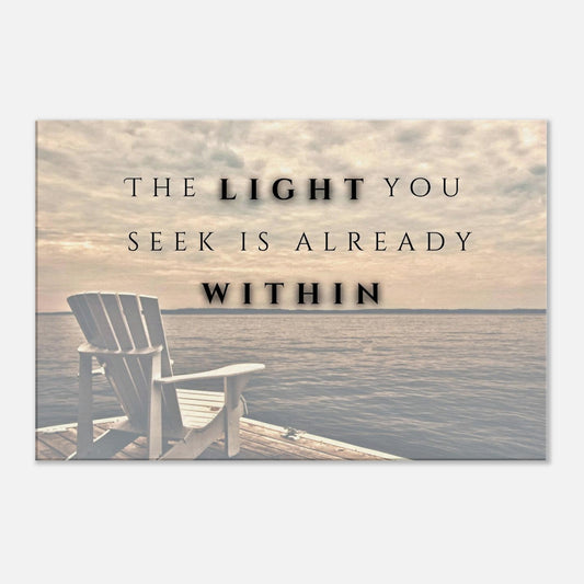 Canvas wall art with quote "The light you seek is already within". Canvas background image is warm cloudy dawn on a lake with a wood chair on a pier.  This decor has a white wall background. 