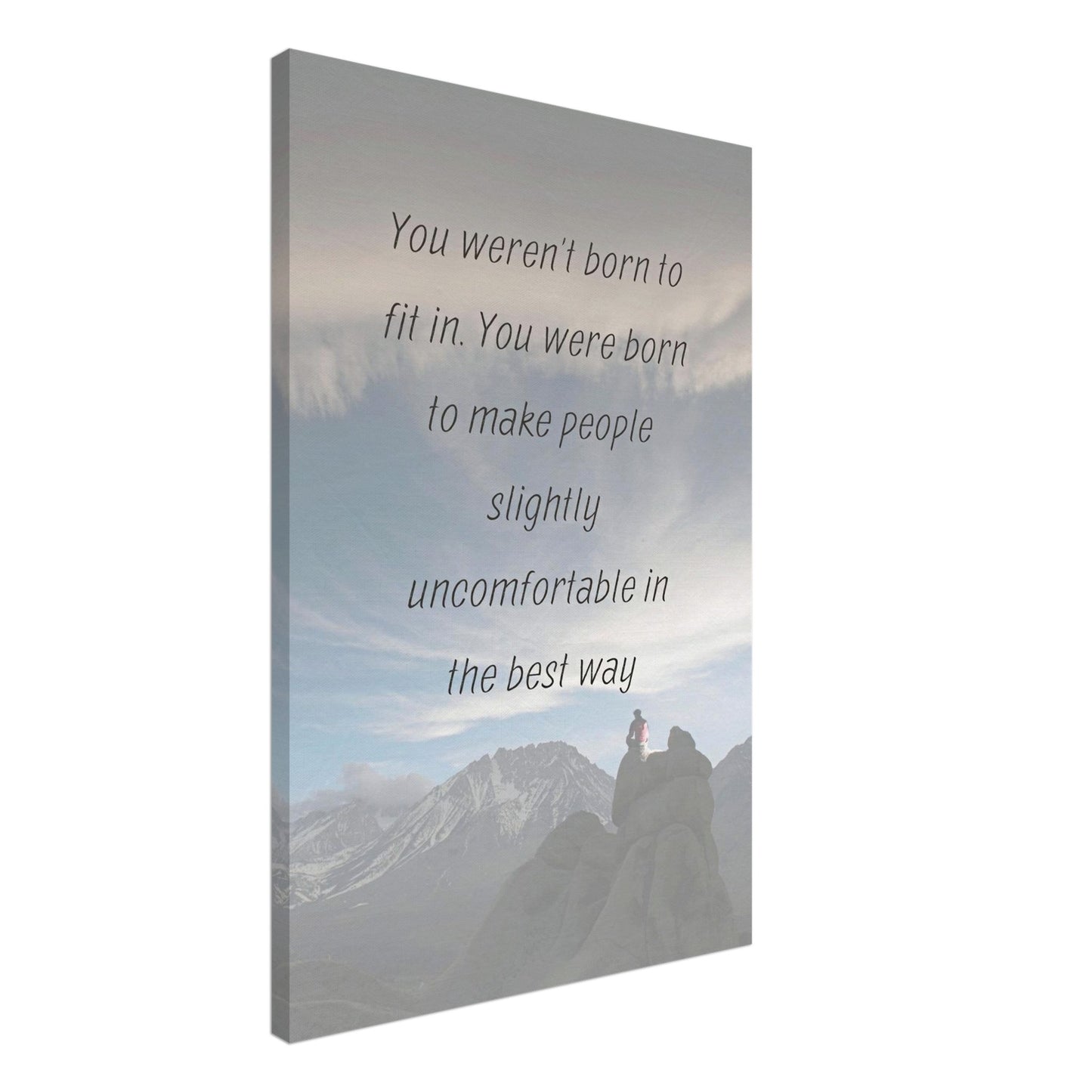 Canvas with bold quote about standing out and mountain view of man seated atop rocks under swirling clouds and snow-capped peaks

