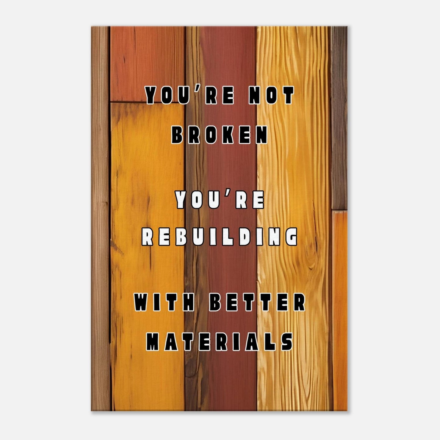 Motivational canvas wall art with quote “You're Not Broken” on rustic brown wood background.