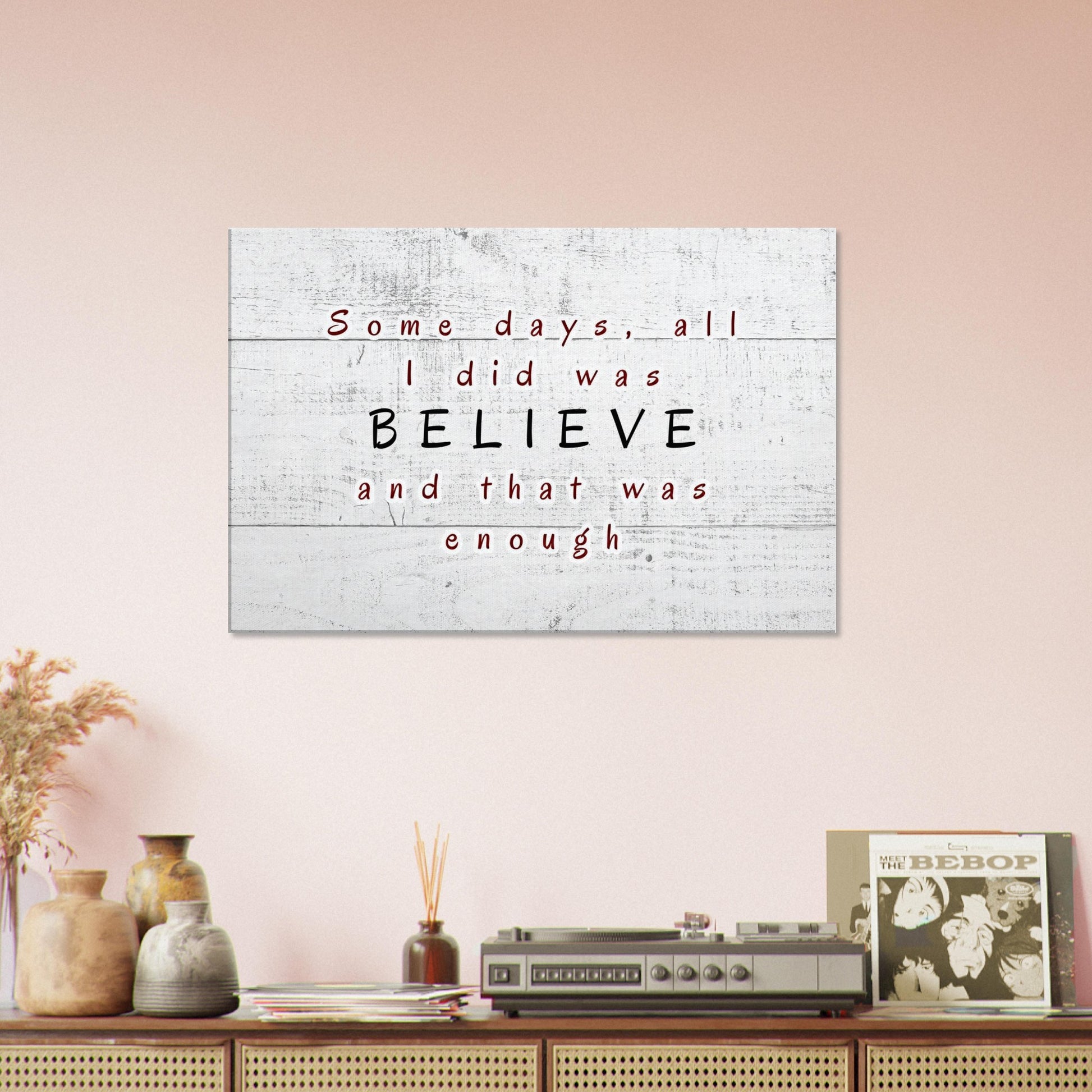 Inspirational wall art with minimalist white plank background and emotional message in bold text

