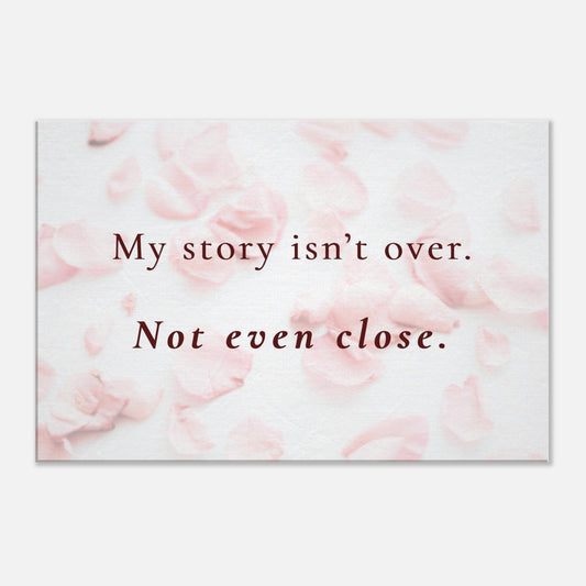 Recovery canvas wall art with the quote “My story isn’t over. Not even close” on soft pink rose petal background

