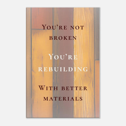 Recovery canvas art with quote "You're Not Broken, You're Rebuilding" and wood background