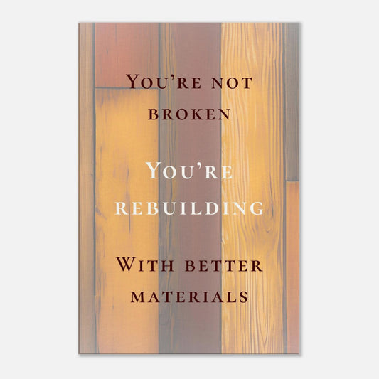 Recovery canvas art with quote "You're Not Broken, You're Rebuilding" and wood background